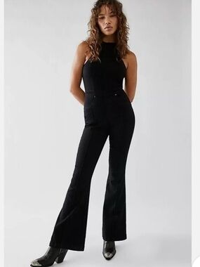 Free People Crvy Sydney Jumpsuit in black stretch denim. Size 8